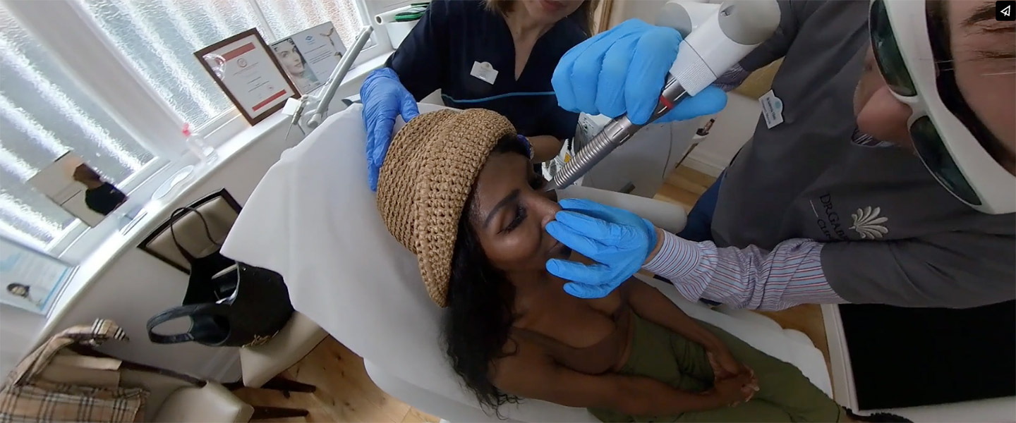 woman getting skin analysis at clinic